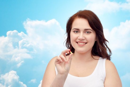 weight-loss-diet-slimming-medicine-people-concept-happy-plus-size-woman-underwear-with-pill-blue-sky-clouds-background_380164-128934