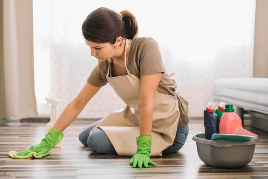 65d5b19950d874f282b5c35f_woman-with-gloves-cleaning-floor_23-2148520978