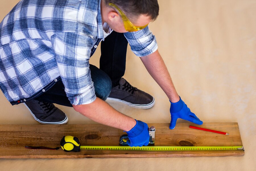 high-angle-man-working-wood_23-2148384482