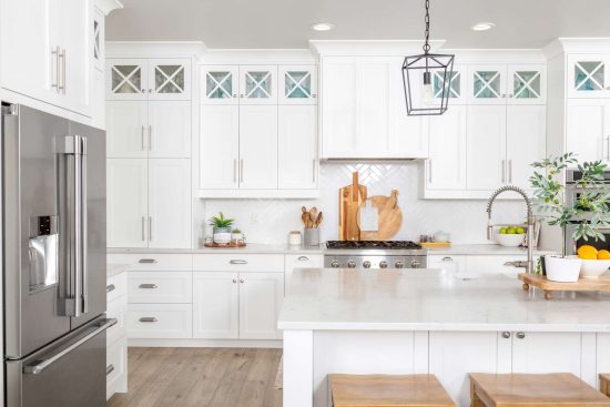 homeguide-kitchen-remodeled-with-new-white-farmhouse-cabinets[1]