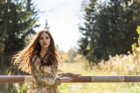 young-woman-with-long-red-hair-linen-dress-gathering-mushrooms-forest_1321-1492